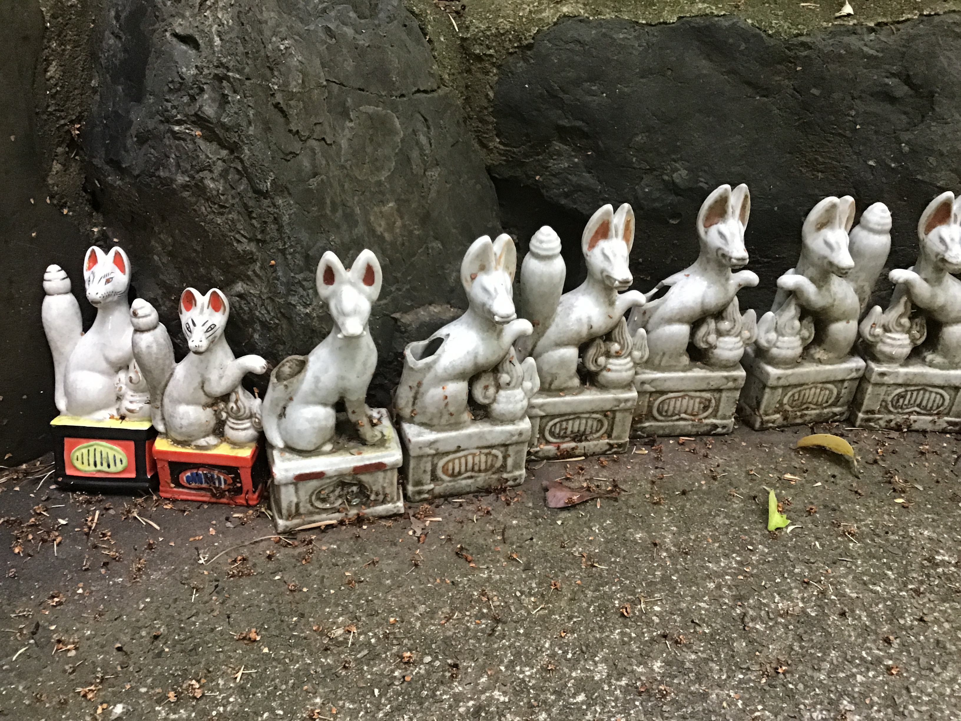 Small statues of foxes in a Shinto Shrine